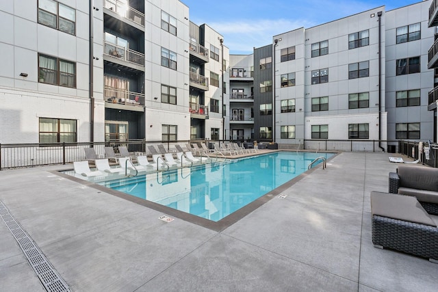 view of swimming pool featuring a patio