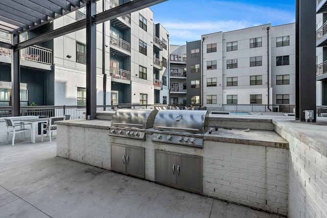 view of patio / terrace featuring area for grilling and a grill