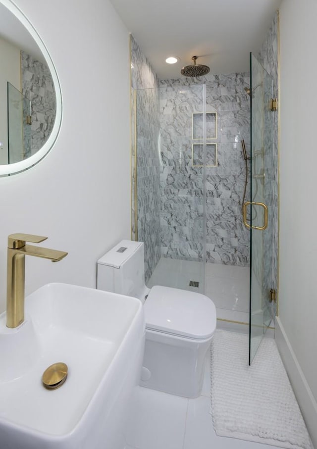 bathroom with toilet, tile patterned flooring, an enclosed shower, and sink