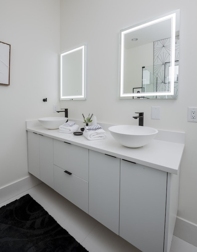 bathroom with vanity and tile patterned flooring