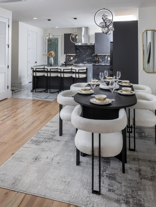 dining area with light hardwood / wood-style floors