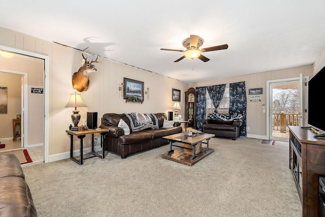 living room with ceiling fan and light colored carpet