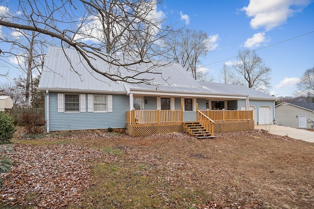 single story home featuring a porch and a garage