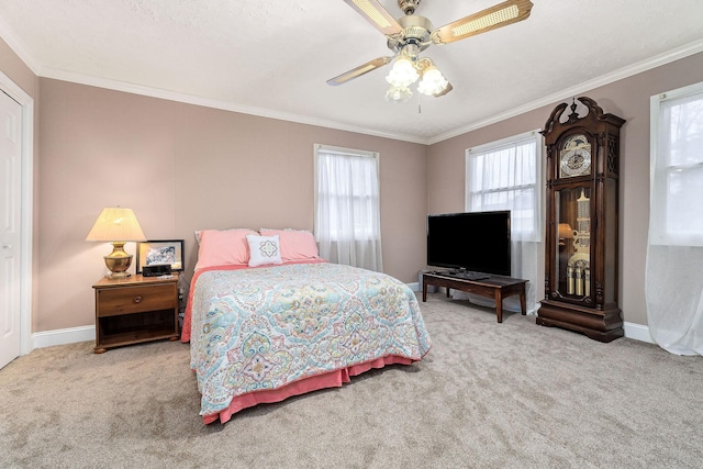 bedroom with ceiling fan, crown molding, and light carpet