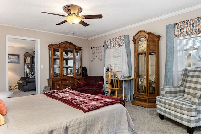 bedroom with multiple windows, ceiling fan, crown molding, and light colored carpet