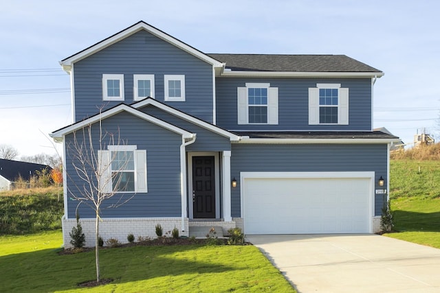 view of front of house featuring a garage and a front lawn