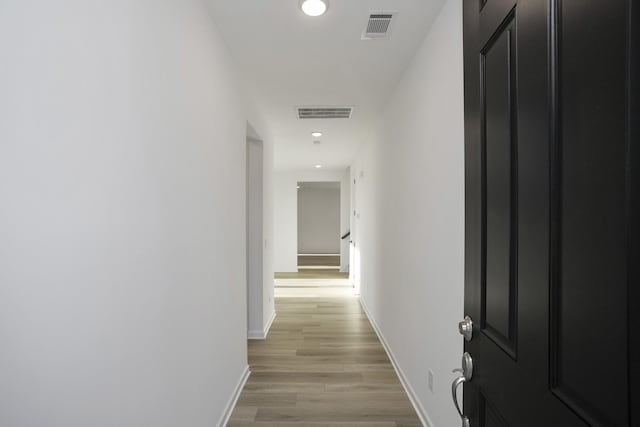 hallway featuring light hardwood / wood-style floors