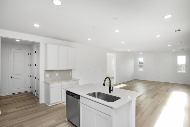 kitchen featuring sink, white cabinetry, dishwasher, a center island with sink, and plenty of natural light