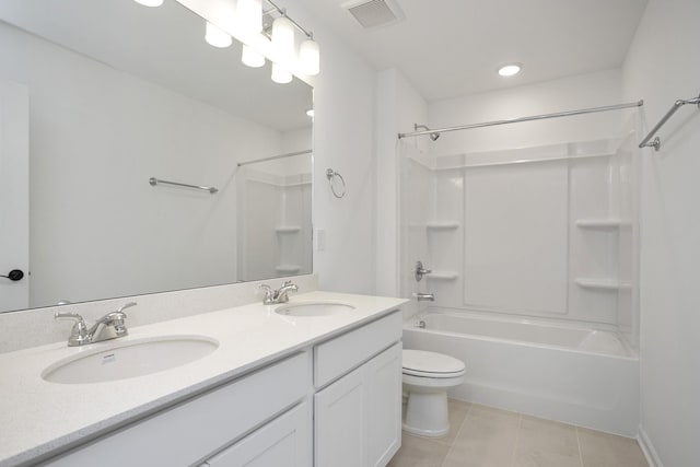 full bathroom featuring vanity, tile patterned flooring, washtub / shower combination, and toilet