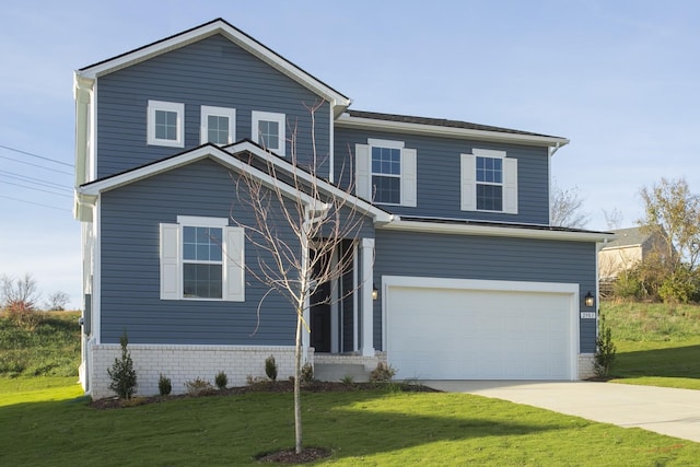 view of front property with a front yard and a garage