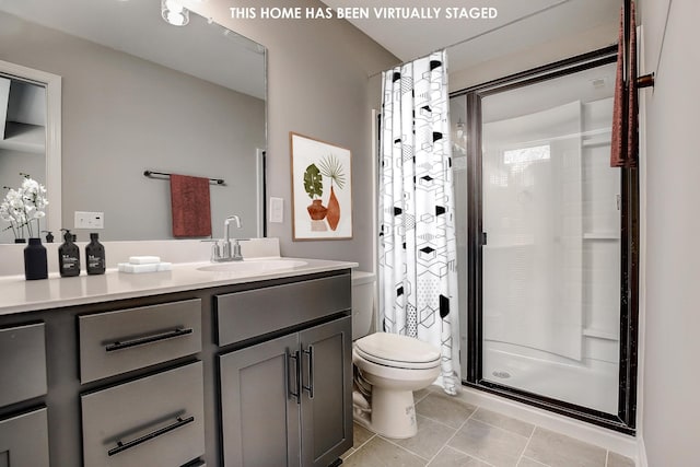 bathroom with toilet, vanity, tile patterned flooring, and a shower with curtain