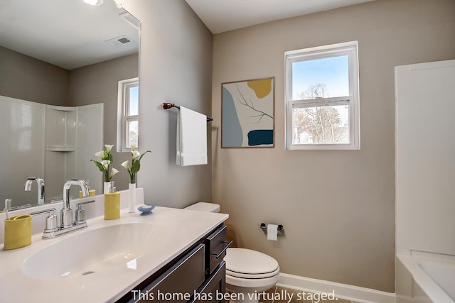 full bathroom with toilet, vanity, and shower / bath combination