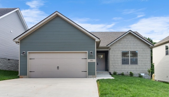 view of front of property with a garage and a front yard