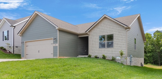 view of front facade with a garage and a front yard