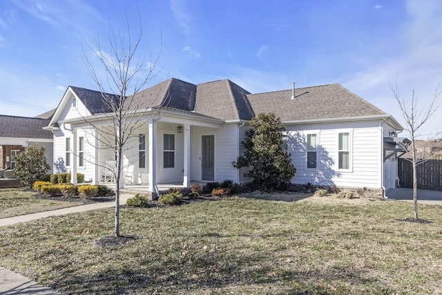 view of front of property featuring a front yard and covered porch