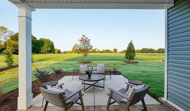 view of patio / terrace featuring a rural view and an outdoor living space