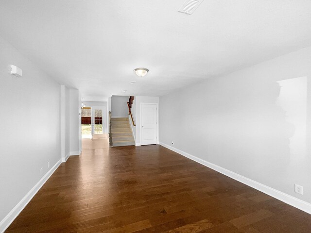 spare room with dark hardwood / wood-style floors