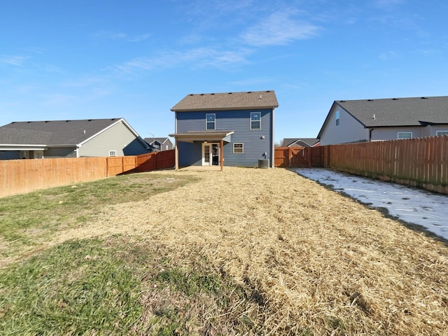 back of house featuring a yard