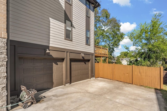 view of side of home featuring a garage