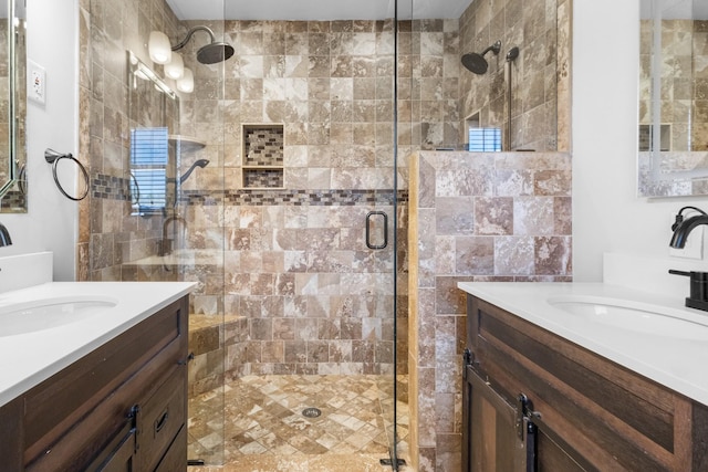 bathroom with an enclosed shower and vanity