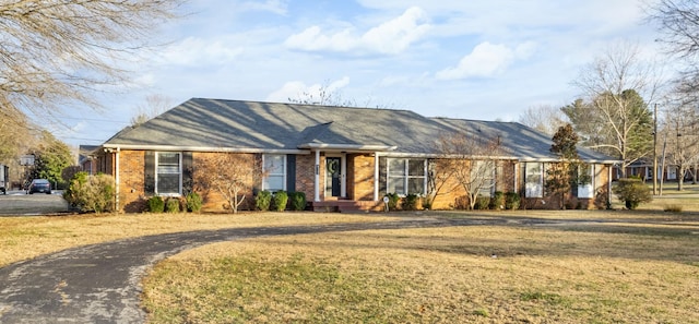 ranch-style home with a front yard