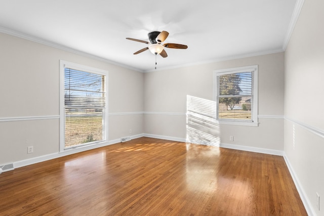 unfurnished room with ceiling fan, crown molding, and wood-type flooring