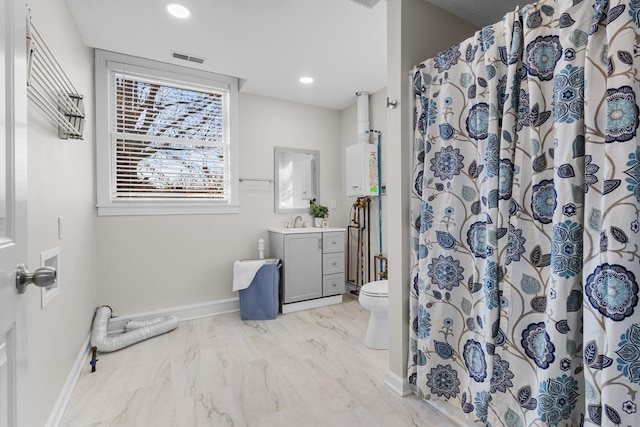 bathroom featuring toilet, water heater, vanity, and a shower with curtain