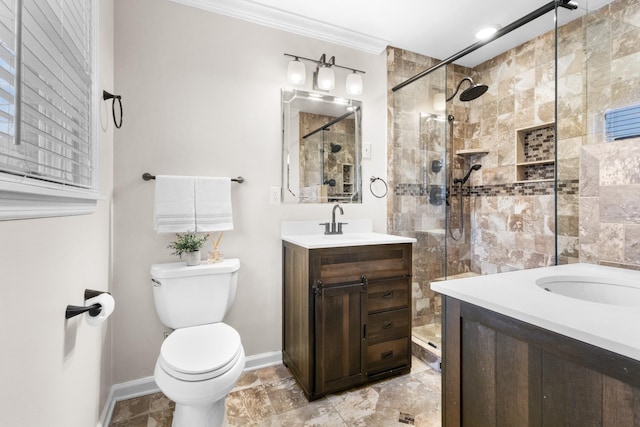 bathroom featuring toilet, a tile shower, crown molding, and vanity