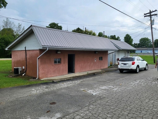 exterior space featuring central air condition unit