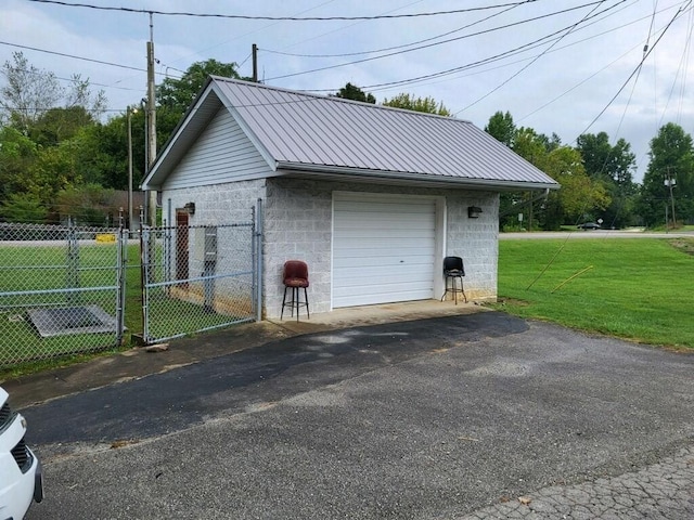 garage with a lawn