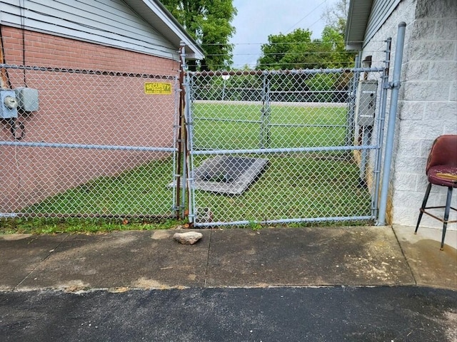 view of tennis court featuring a lawn