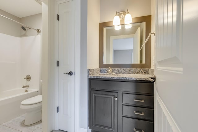 full bathroom featuring toilet, vanity, and washtub / shower combination