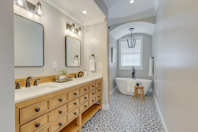 bathroom with ornamental molding, a bathtub, tile patterned flooring, and vanity