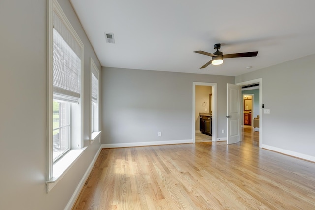 spare room with ceiling fan and light hardwood / wood-style flooring