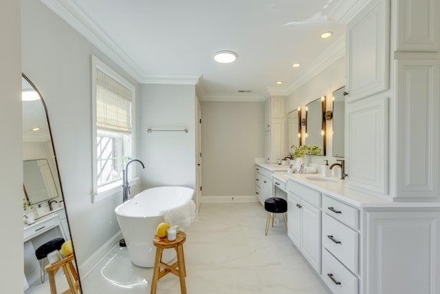 bathroom with ornamental molding, a tub to relax in, and vanity