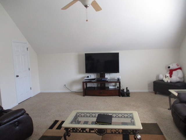 carpeted living room with ceiling fan and lofted ceiling