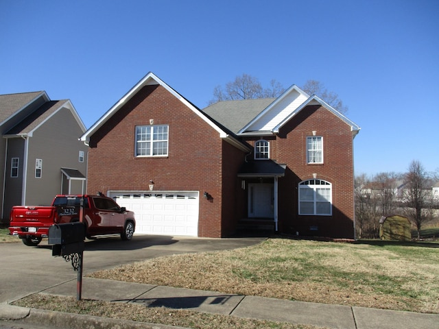 view of property featuring a front yard and a garage