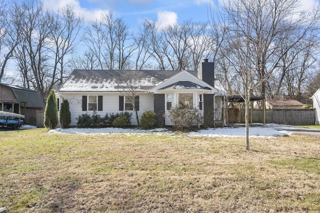 single story home featuring a carport and a front yard