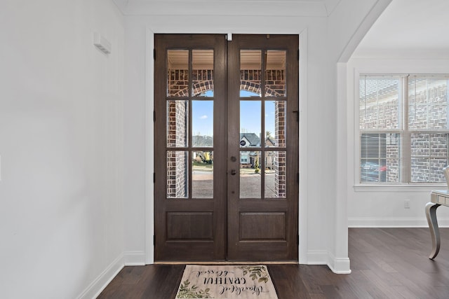 foyer entrance featuring dark hardwood / wood-style floors and french doors