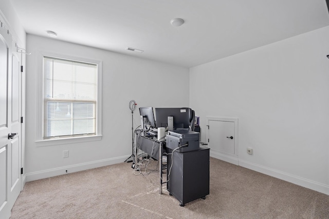 home office featuring light carpet