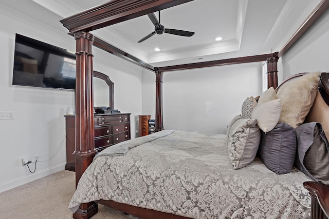 bedroom with light carpet, ornamental molding, a raised ceiling, and ceiling fan