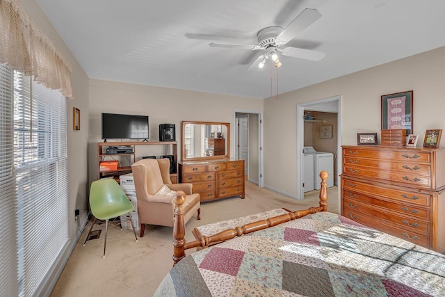 carpeted bedroom with separate washer and dryer and ceiling fan