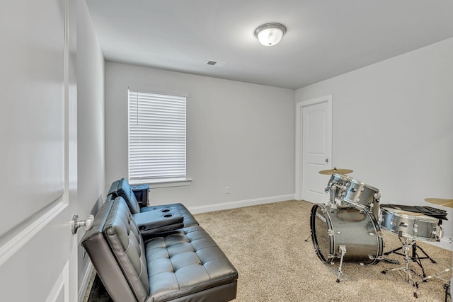 living area featuring light colored carpet