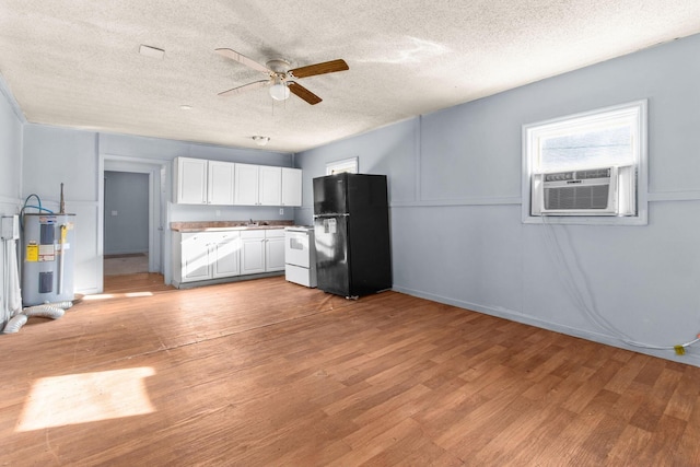 kitchen with white range with electric cooktop, light wood-type flooring, black fridge, water heater, and white cabinets