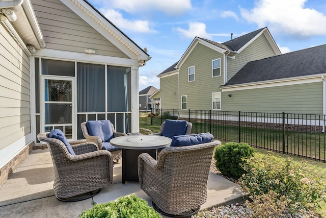 view of patio with a sunroom