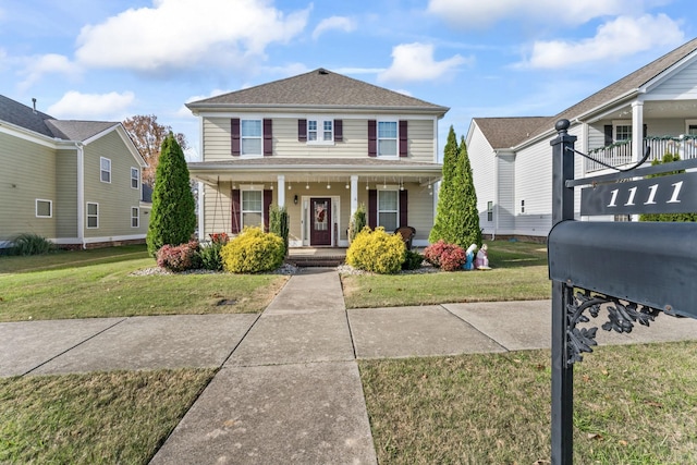 view of front facade featuring a porch and a front yard