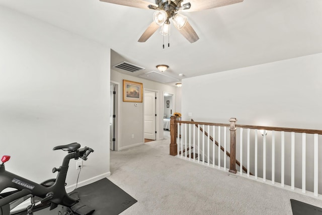 workout room with light colored carpet