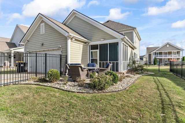 back of house with a patio area, a yard, and a garage