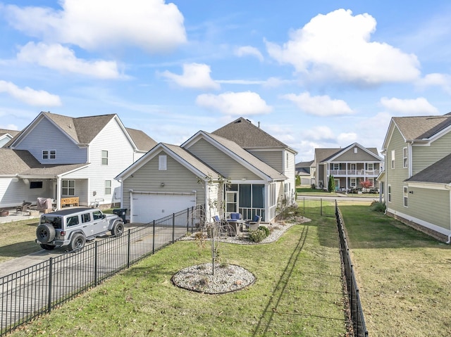 view of front of home with a garage and a front yard