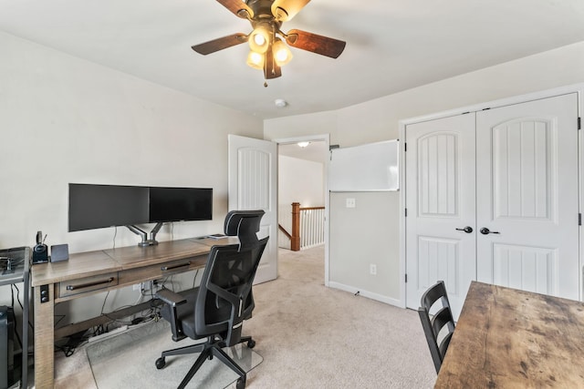 office area with light carpet and ceiling fan